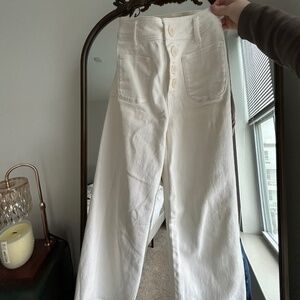 Buttoned up pocketed cream jeans